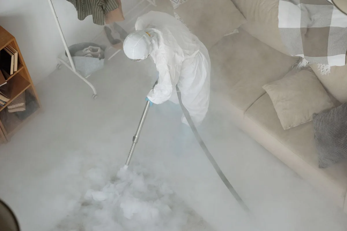 Biohazard cleanup technician in protective equipment, Daytona Beach Shores, FL